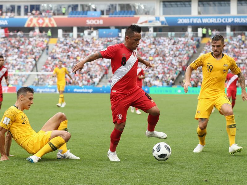 Christian Cueva of Peru gets away from Trent Sainsbury and Joshua Risdon of Australia during the 2018 FIFA World Cup Russia group C match between Australia and Peru at Fisht Stadium on June 26, 2018 in Sochi, Russia. (Photo by Robert Cianflone/Getty Images)